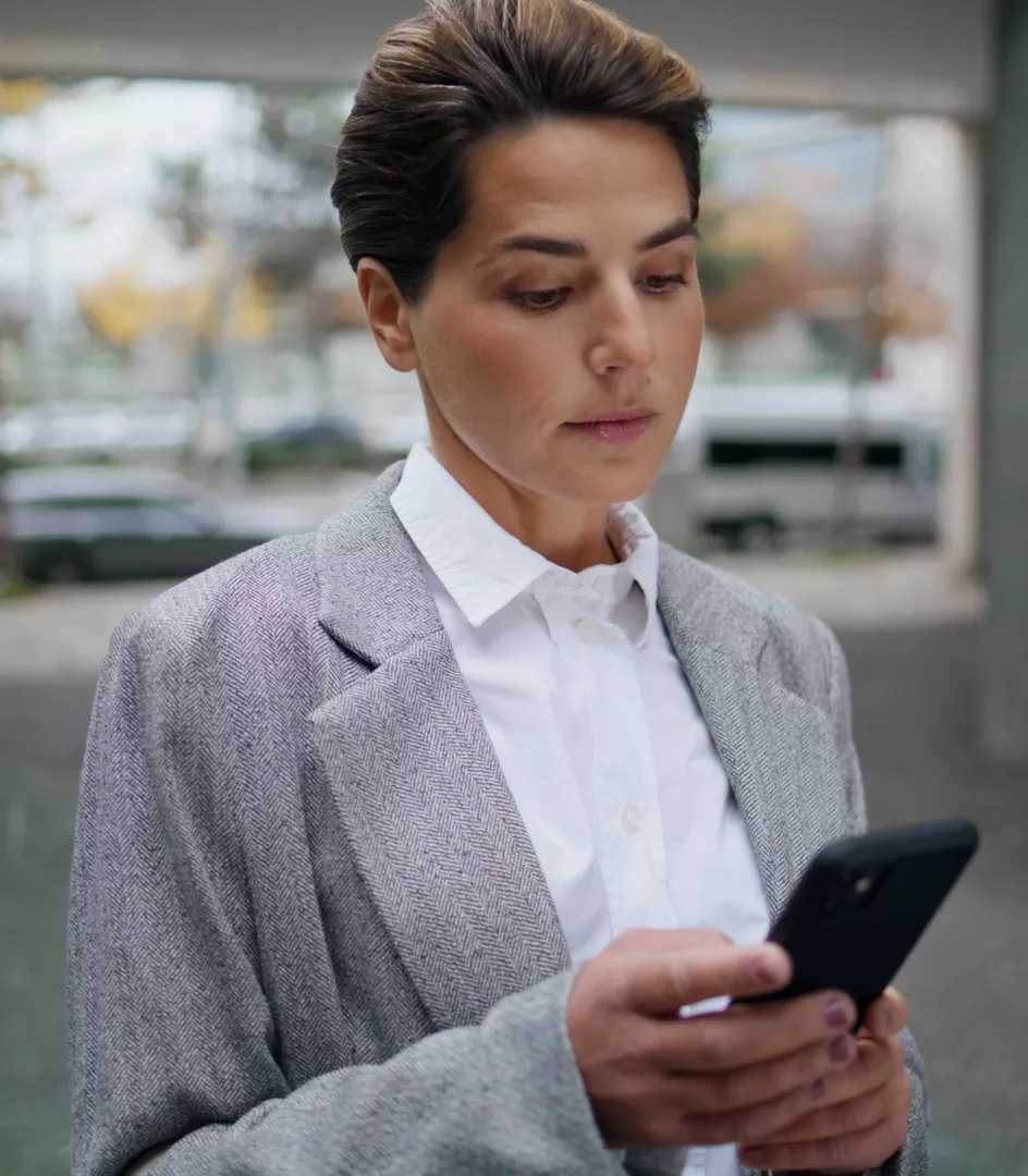 businesswoman messaging on her smartphone 